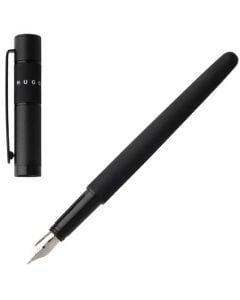 The Hugo Boss, Ribbon, Black Lacquer Fountain Pen is fitted with a steel nib, engraved and polished by hand, set into a glossy blackened chrome grip. A soft matte black lacquer runs the length of the body, a soft engraved design is on the brass, chrome pl