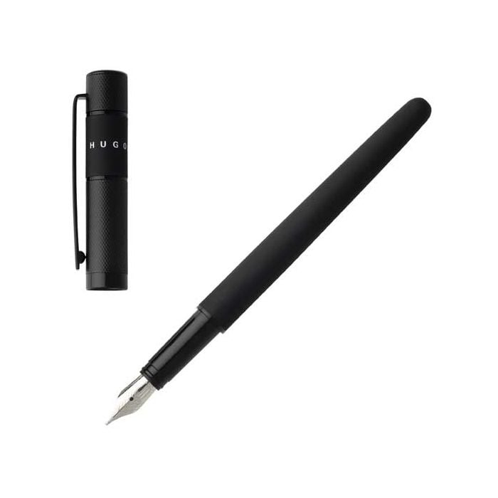 The Hugo Boss, Ribbon, Black Lacquer Fountain Pen is fitted with a steel nib, engraved and polished by hand, set into a glossy blackened chrome grip. A soft matte black lacquer runs the length of the body, a soft engraved design is on the brass, chrome pl
