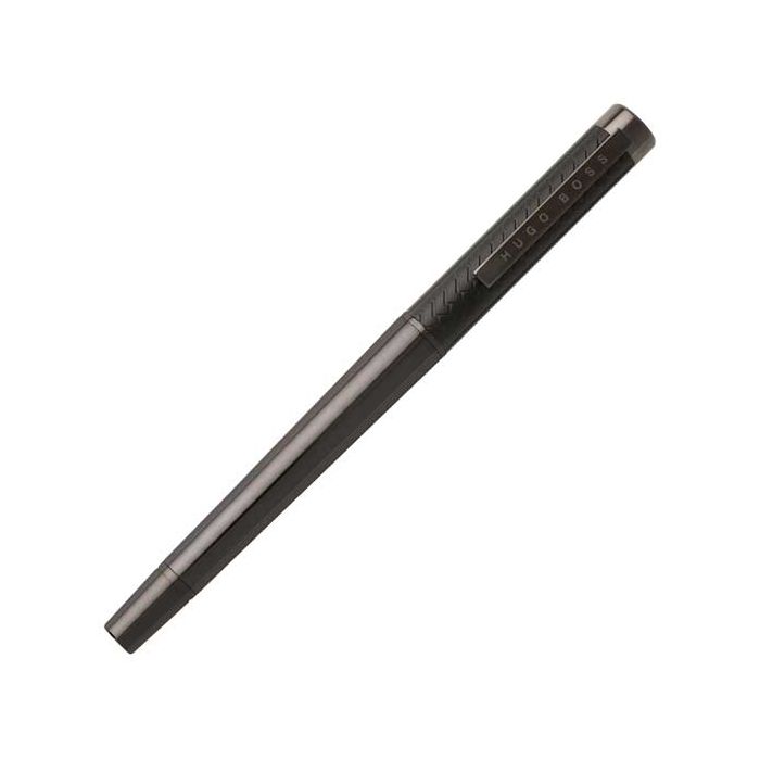 The Hugo Boss, Tire Rollerball Pen has been finished in complementary colouring across the entire surface. Gunmetal plated brass polished to a high shine and soft black rubber detailing. 
